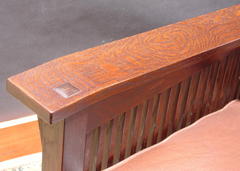 Close-up of pinned through-tenon on top of arm and hand-selected, highly figured quarter-sawn white oak.